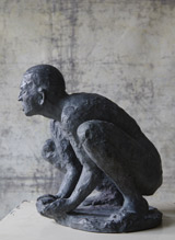 L'homme accroupi
